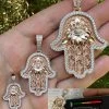 Real Rose Gold & 925 Sterling Silver Hamsa Evil Eye Hand Iced MOISSANITE Pendant 2 Real Rose Gold & 925 Sterling Silver Hamsa Evil Eye Hand Iced MOISSANITE Pendant -Harlem Bling Shop harlembling real rose gold and 925 sterling silver hamsa evil eye hand iced moissanite pendant 32489.1694222566